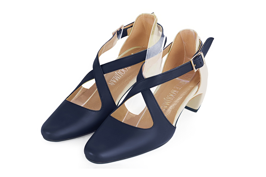 Navy blue and off white women's open side shoes, with crossed straps. Round toe. Low comma heels. Front view - Florence KOOIJMAN